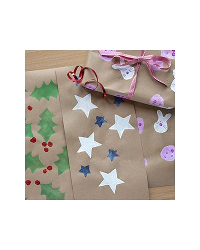 Examples of stencilled wrapping paper including holly leaves, stars and Easter bunnies